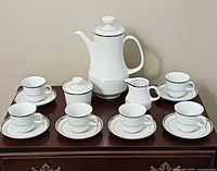 Full 17-piece demitasse set on table