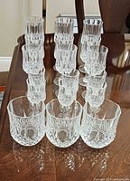 Front view showing entire 18-piece set arranged by type on table