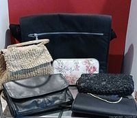 Group shot showing all six items: laptop bag, leather bag, satin clutch, beaded clutch, woven raffia bag, floral wallet