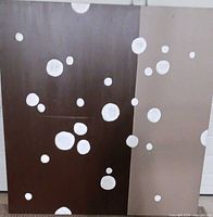 Front view of bubble design canvas showing brown and tan split background with white circles