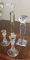 Group shot of four candlesticks showing relative sizes and styles