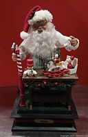Animated Santa figure on base, toys on workbench