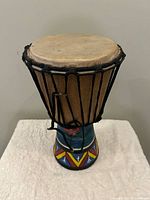 Top view of djembe showing natural skin head and rope tension system