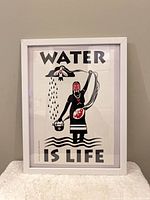 Full view of framed flyer showing artwork and text