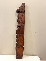 Full view of carved thunderbird totem front