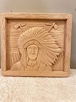 Front view of carved wooden relief