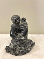 Front view Inuit family soapstone sculpture