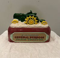 Front view showing tractor lid and "John Deere General Purpose Farm Tractor" plaque