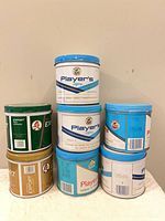 Six tins stacked, front view