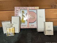 Front view showing three Oscar boxes, Chantilly gift set, Chanel bottle