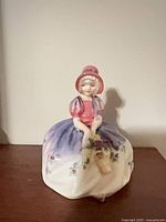 Front view of Royal Doulton Monica figurine showing colours and design