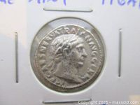 Obverse of Trajan denarius in flip showing bust right