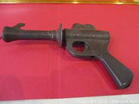 Left side view of steel Buck Rogers ray gun