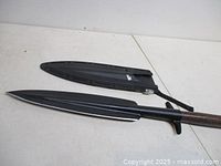 Spear head beside sheath