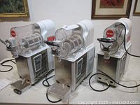 Front view of three VEVOR slushy machines on counter showing overall condition