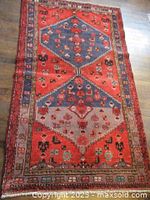 Full view of rug showing entire field and borders