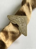 Full view of Gorham sterling floral corner bookmark on wood prop