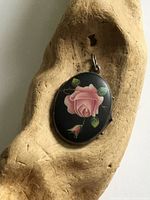 Front of locket showing painted rose