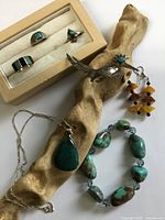 All seven jewelry pieces arranged together