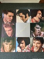 All nine components laid out: eight LP sleeves plus booklet