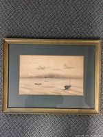 Full view of framed charcoal marina artwork in gold-tone frame