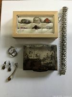 Group overview showing box, bracelet, rings, earrings and pendant