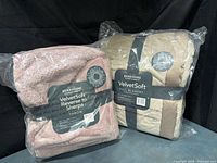 Both packaged blankets side by side