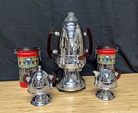 Full lot showing percolator, sugar bowl, creamer, and two tins