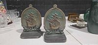 Front view of both brass ship bookends