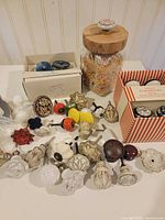 Overview of assorted knobs, boxes and jar