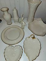 Group shot of nine Lenox ivory porcelain items