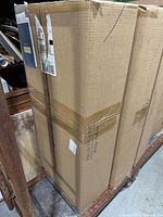 Sealed Frontgate shipping box standing upright
