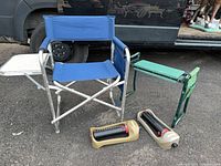 Lot overview showing folding chair, garden kneeler bench and two sprinklers