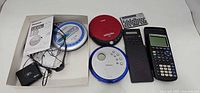 All items overview: 3 CD players, 2 calculators, Wordmaster electronic dictionary