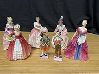 Front view of all seven figurines lined up