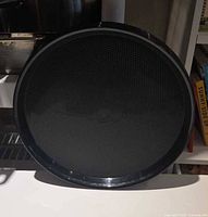 Round black textured plastic serving tray