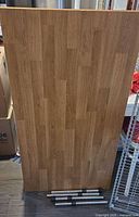 Front view of solid wood tabletop with legs placed in front