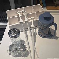 Group shot of organizer, pumps, French press, shakers