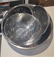Nested stainless steel colanders and bowls