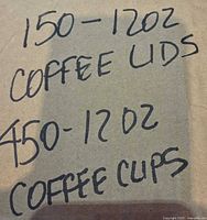 Handwritten note showing quantities of cups and lids