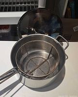 Saucepan, lid and mesh basket insert