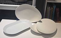 White ceramic plates and platter displayed