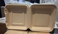 open 9" square hinged clamshell container interior and lid