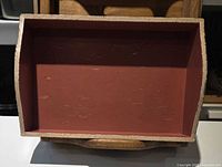 Small tray with red interior and speckled rim