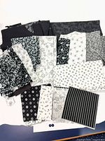 All fabric pieces spread out showing patterns and sizes