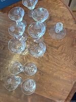Group of Cornflower etched stemware and candle holder on table