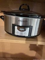 Front view of stainless steel Crock-Pot slow cooker showing digital control panel