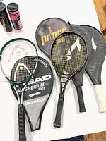 Overview of four racquets with covers
