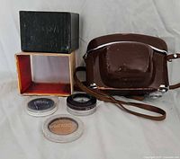 Group shot of case, lens box, filters