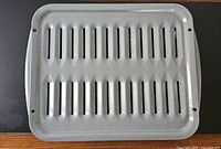 Top view of slotted broiler pan insert